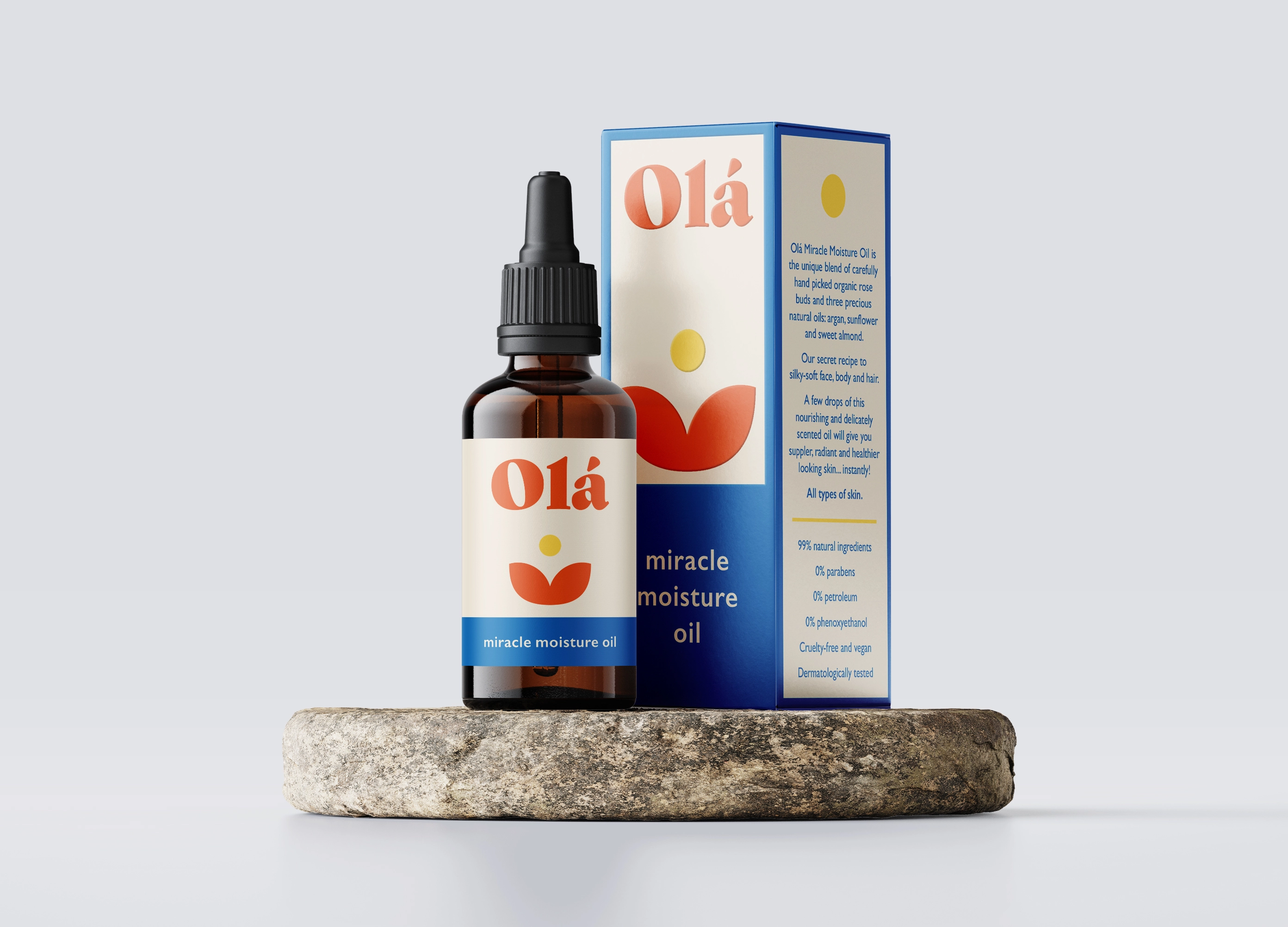 a dropper bottle and box image of the colourful Ola Miracle Moisture Oil packaging sitting on a round stone